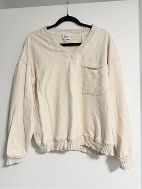 Buckle cream sweater